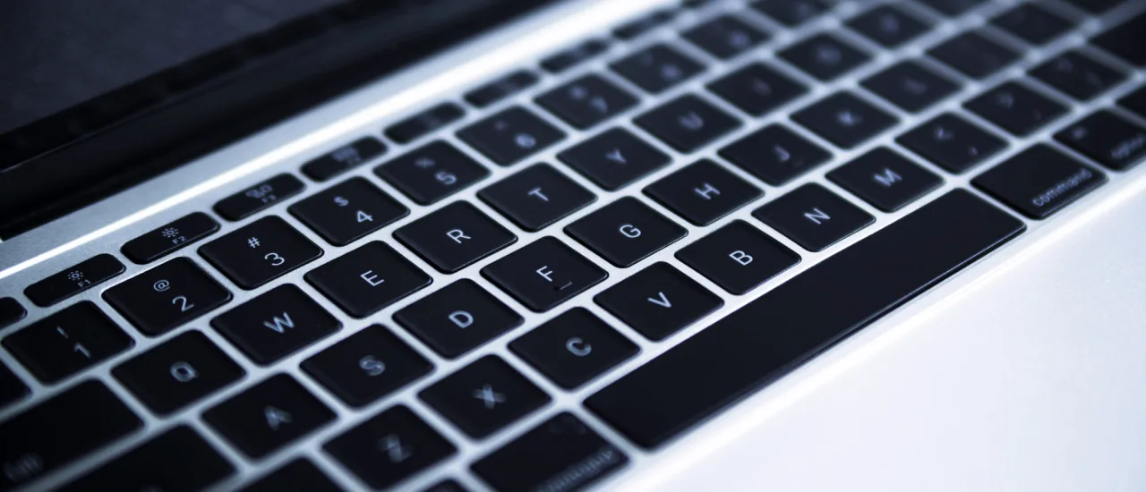 Grey laptop keyboard close up